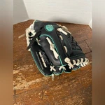 Rawlings Black & White Glove W/ Teal Stitching 10.5IN PL105BMT. Fixed Price $13.00.