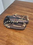 Nicely Used Rawlings RL125B Brown And Black Sold Pre-owned Fair To Good Shape. Fixed Price $49.88.